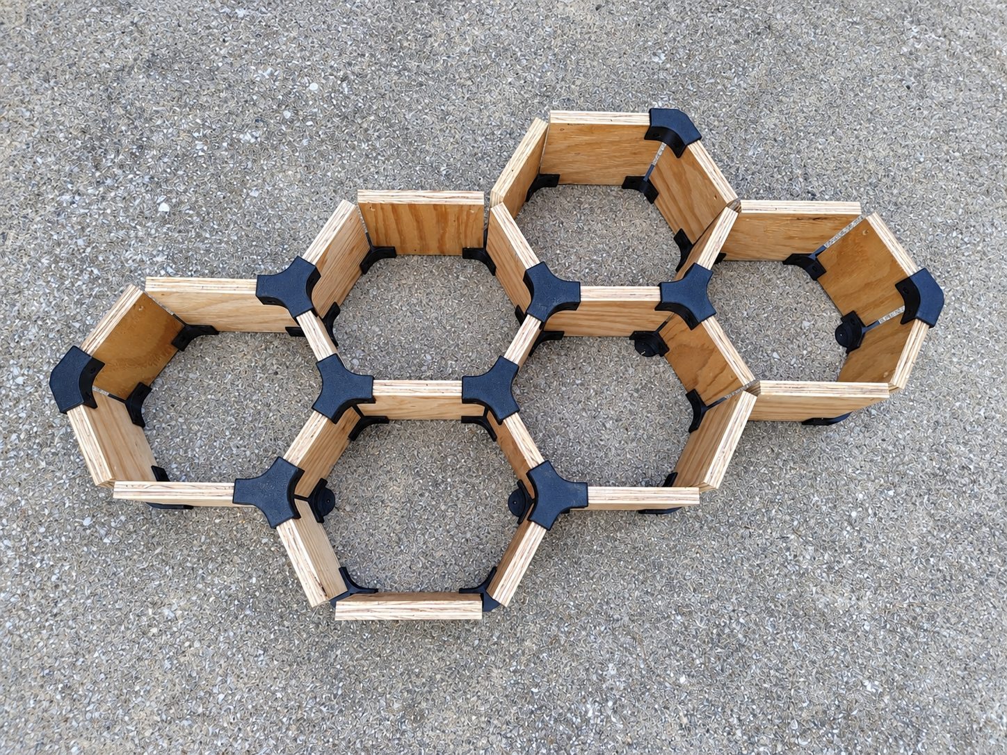 Larger HexaNect plywood-and-printed-connector layout laid out for assembly
